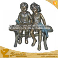 Brozne Children Boy And Girl Reading Book On Beach Statue BFSN-B099A